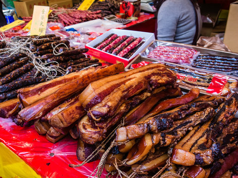 Cured meat, Chinese ham and Chinese sausage sold on Taiwan traditional market. Text meaning: Chinese ham or Jinhua ham.