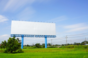 Blank billboard for advetising at rice field with moving cloud o