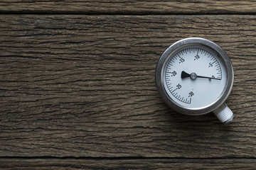pressure gauge on wood background