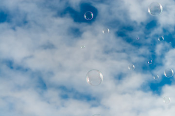 Soap bubbles in blue sky