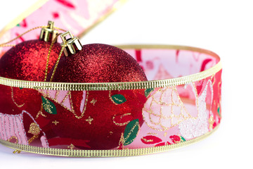 Christmas balls and ribbon in winter setting.
