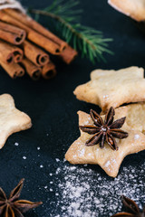 Star shaped cookies with cinnamon and anise on the table