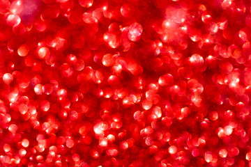 Red Sparkling Glitter bokeh Background.