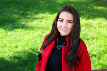 beautiful asian woman in red coat