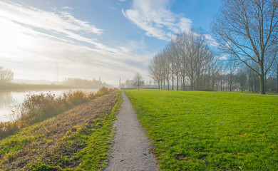 Shore of a canal through the countryside at fall