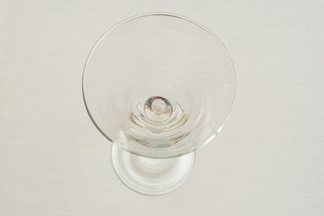 An empty martini glass isolated on a white background