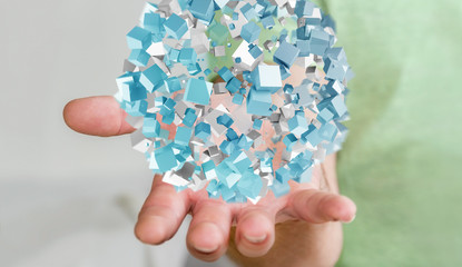 Businessman holding flying abstract sphere with shiny cube 3D re