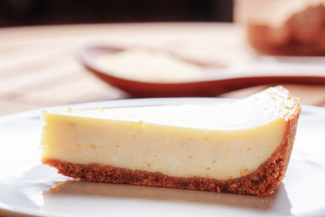 Closeup view of piece of delicious freshly baked cheesecake