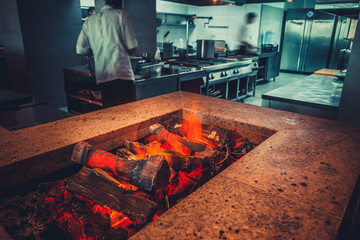 Interior of modern restaurant with fireplace close-up