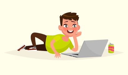 Boy lying on the floor looking at laptop monitor. Vector illustr