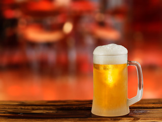 cold light beer glass mug in a pub