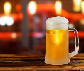 cold light beer glass mug in a pub