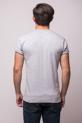Obraz premium Back part t-shirt on a young man isolated