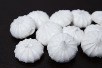 Fototapeta na wymiar meringue on a dark table