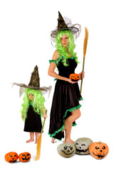 Cute little witch and her mother on a white background celebrates Halloween