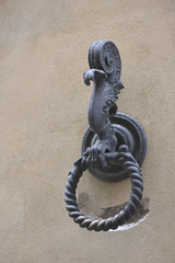 Outdoor old horse hitching ring on a historical wall