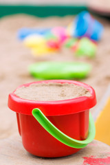 a bucket of sand in the sandbox