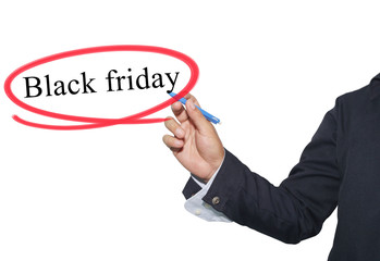 Hand of young businessman write the word Black Friday isolated o