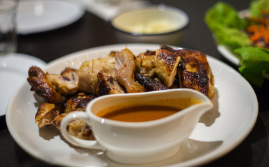 roast chicken display on table restaurant. Selective focus, shallow depth of field.
