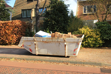 Loaded garbage dumpster