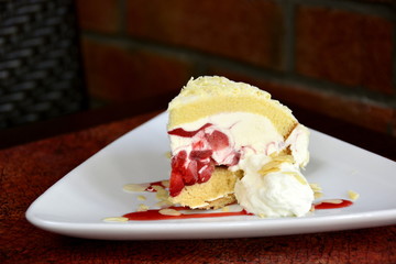 Restaurant food with fresh ingredients - strawberry cake with whipped cream