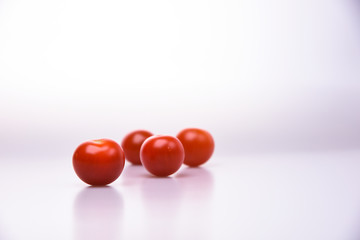 Fresh cherry tomatoes group isolated on white background cutout
