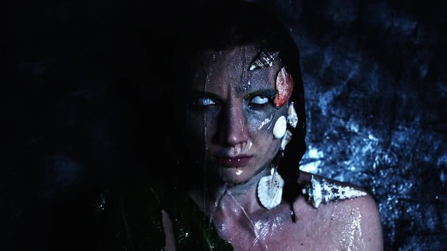4k Halloween Shot of a Horror Woman Mermaid and Water Pouring on her Head