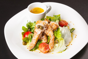 Fototapeta na wymiar fish salad with Greens and gravy