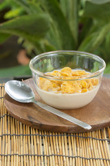 cornflakes with milk on the  cup