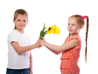 boy gives a girl yellow tulips