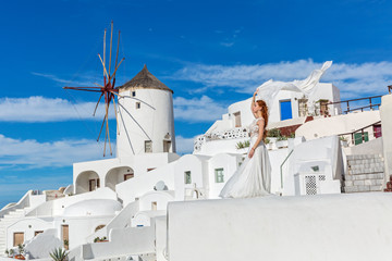 Fototapeta premium Beautiful woman in white dress