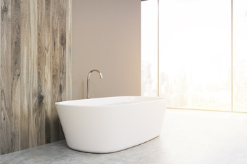 Fototapeta na wymiar Side view of a white bathtub, toned