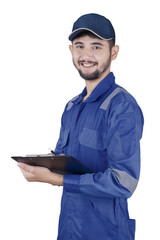 Young mechanic holds clipboard