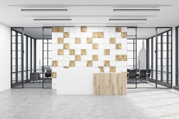 Office lobby with tiled white and wooden wall