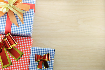 Obraz premium Gift box is placed on wooden floor.