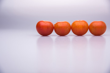 Fresh cherry tomatoes with drops in line