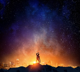 Fototapeta premium Businessman against starry sky . Mixed media