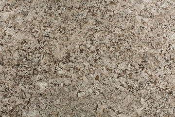 Beige and brown granite background.