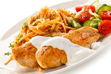 Fried chicken fillet, pasta and vegetables 
