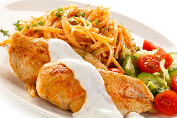 Fried chicken fillet, pasta and vegetables 