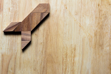 Naklejka na ściany i meble Wooden tangram puzzle in rocket shape, start up or discovery con