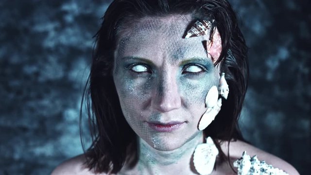 4k Halloween Shot of a Horror Woman Mermaid Close-up with Whiteout eyes