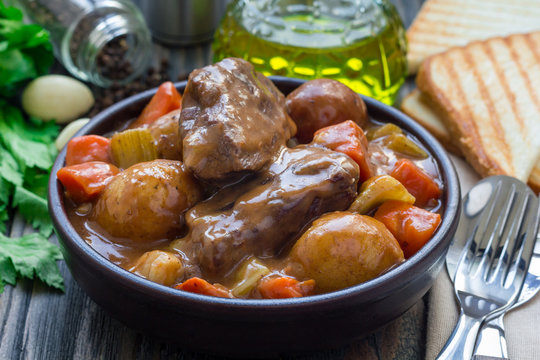 Hearty beef stew with carrot, celery, shallot and potato, horizontal