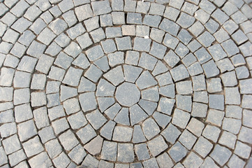 Circular pattern block pavement texture.