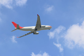 The plane was flying up the sky on a cloudy sky background.