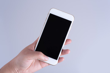 Hand holding white smartphone with black screen, , isolated on white background