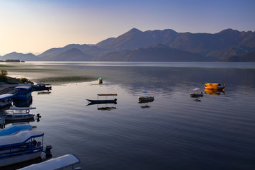 Boats near coast at sea beautiful sunset