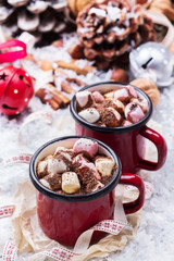 Hot chocolate with marshmallows and spices on christmas table