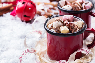 Hot chocolate with marshmallows and spices on christmas table
