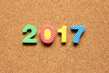 Wording 2017 from toy alphabet on cork board background (Concept